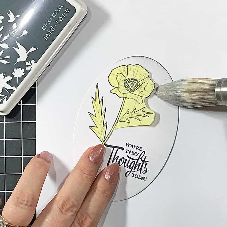 Coloring a Poppy With Copic Markers. Blending grey ink in from the edges of the oval, over a masked poppy.